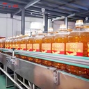 Small Bottled Oil Packaging Machinery 500ml 1L 2L 5L Automatic Piston Filling Machine 2000-4000BPH Factory Price