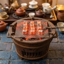 Using coconut shell charcoal, Indonesian producers shape these briquettes into cubes.